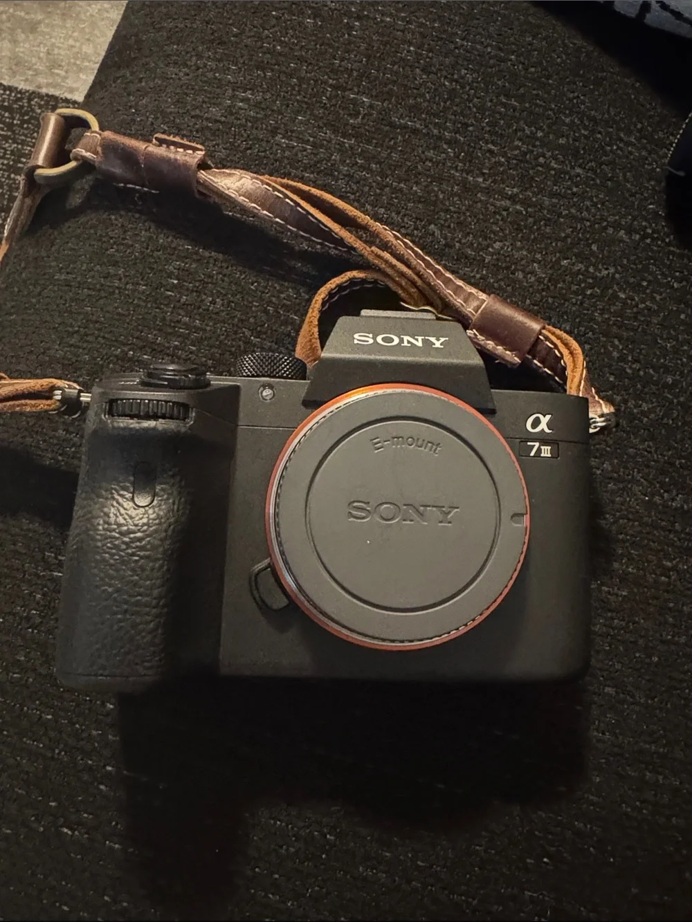 Sony A7 Series 3 Black Mirrorless Camera Body with Brown Leather Strap